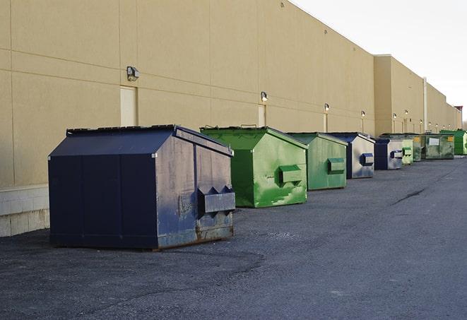 large construction waste containers in a row at a job site in Belleville